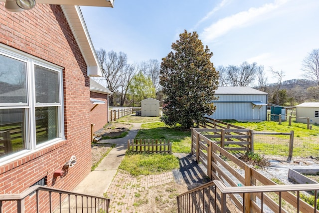 view of yard with a storage unit