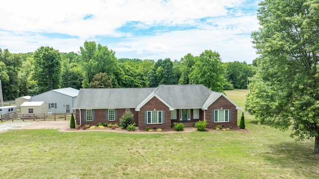 ranch-style house with a front yard