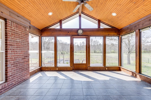 unfurnished sunroom with ceiling fan, wooden ceiling, and lofted ceiling