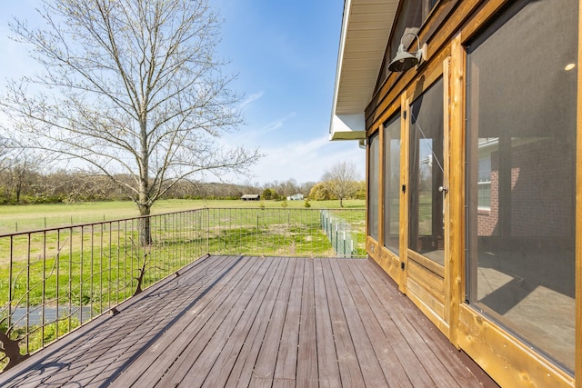 wooden terrace featuring a rural view