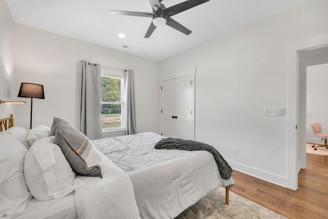 bedroom featuring hardwood / wood-style flooring and ceiling fan