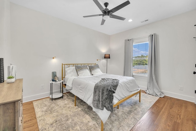 bedroom featuring hardwood / wood-style flooring and ceiling fan