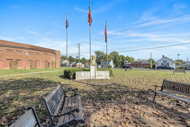 view of property's community with a yard