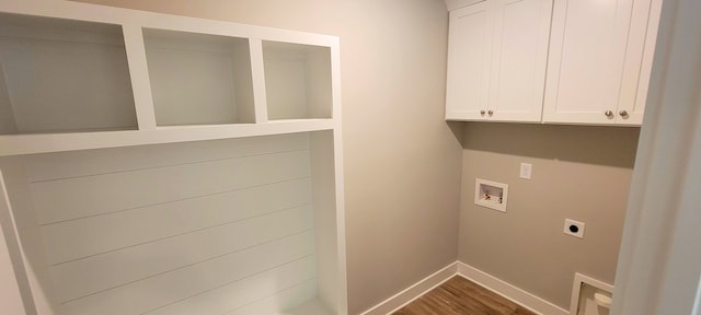 laundry room featuring hookup for an electric dryer, cabinets, hookup for a washing machine, and wood-type flooring