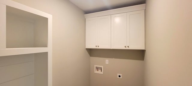 laundry room with hookup for an electric dryer, hookup for a washing machine, and cabinets