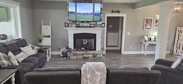 living room featuring hardwood / wood-style flooring and a fireplace