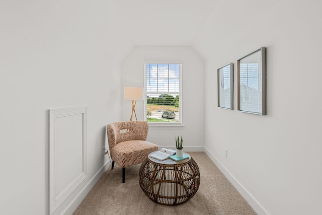 sitting room with carpet and lofted ceiling