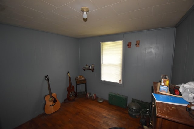 miscellaneous room with dark hardwood / wood-style floors