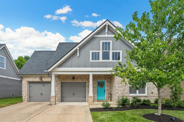 view of front of house with a garage and a front lawn