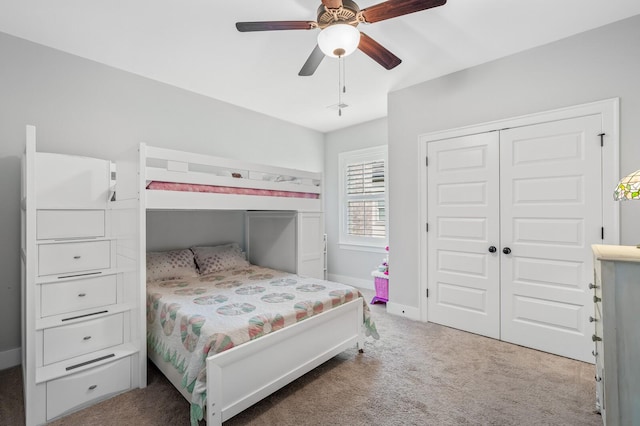 bedroom with ceiling fan, a closet, and carpet