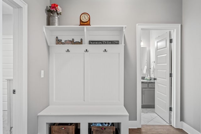 mudroom with light hardwood / wood-style floors