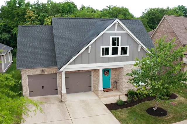 view of front of property with a garage and a front yard