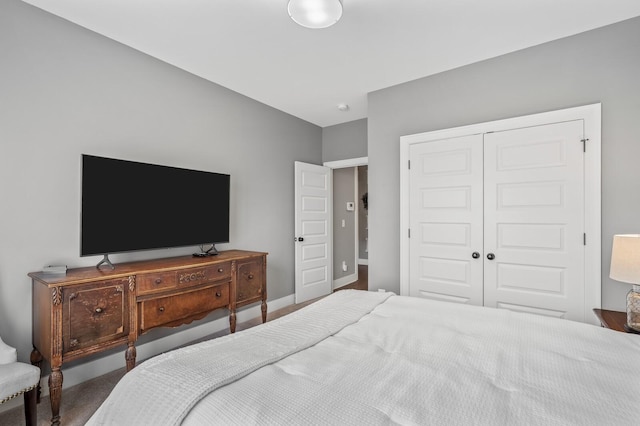 carpeted bedroom with a closet