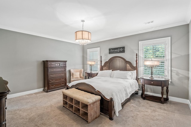 bedroom with light carpet, crown molding, and a notable chandelier