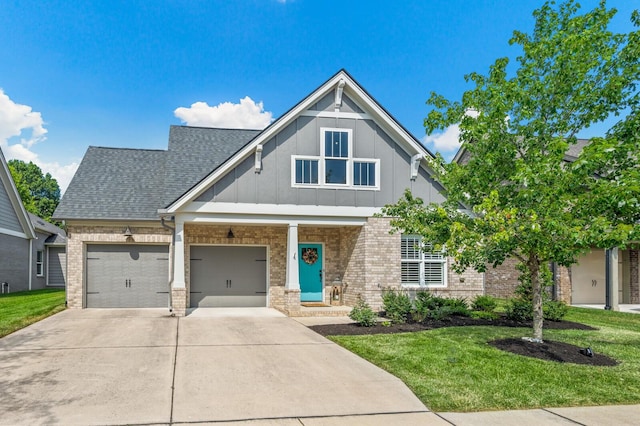 craftsman-style home with a garage and a front lawn