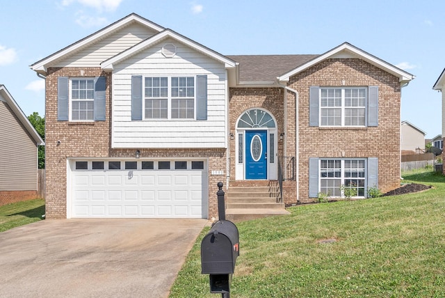 bi-level home featuring a front yard and a garage