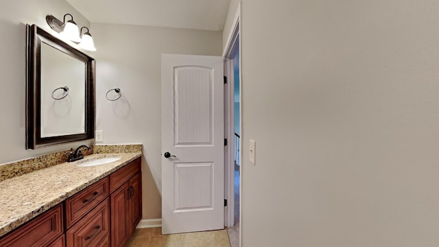 bathroom with tile patterned flooring and vanity