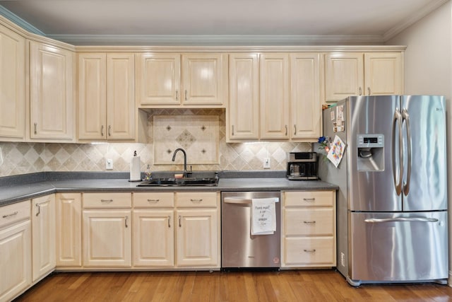 kitchen with sink, stainless steel appliances, light hardwood / wood-style flooring, backsplash, and ornamental molding