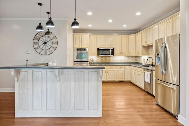 kitchen featuring sink, light hardwood / wood-style flooring, crown molding, decorative light fixtures, and appliances with stainless steel finishes