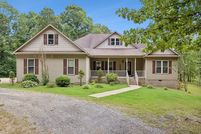 view of front of home with covered porch and a front yard