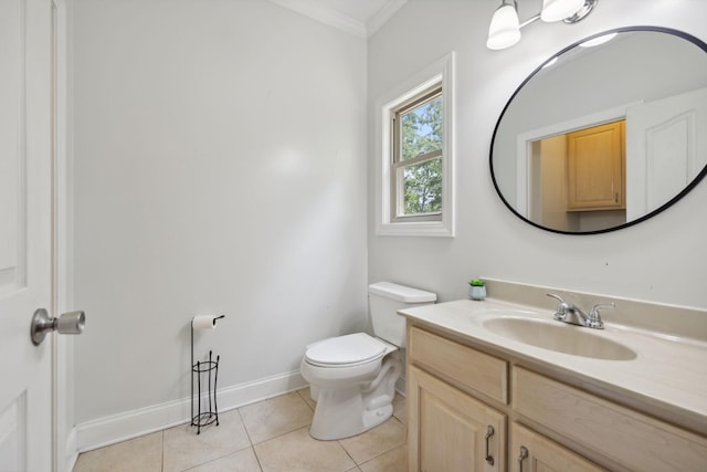 bathroom featuring toilet, tile patterned flooring, vanity, and ornamental molding