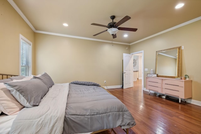 bedroom featuring dark hardwood / wood-style floors, ceiling fan, and ornamental molding