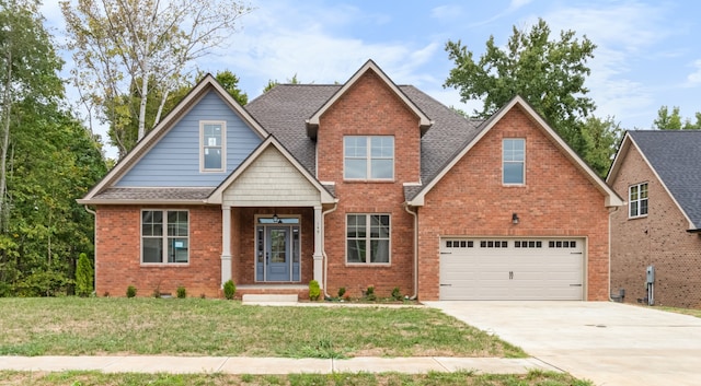 craftsman-style home featuring a front yard and a garage