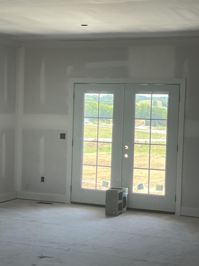 doorway to outside with a healthy amount of sunlight and french doors