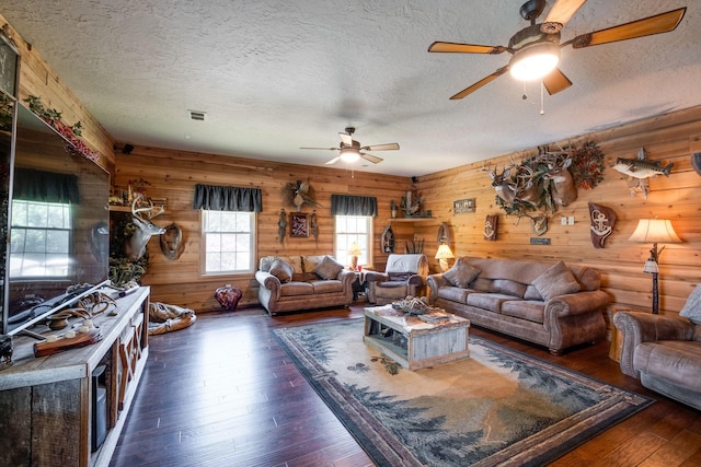 351 New Era Landing Rd, Linden, TN 37096 - living room with ceiling fan, a textured ceiling, wood-type flooring, and wood walls