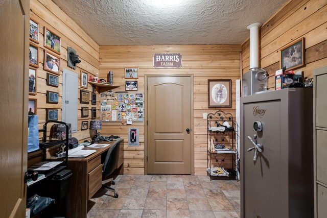 351 New Era Landing Rd, Linden, TN 37096 - office area with wood walls, stone finish flooring, and a textured ceiling