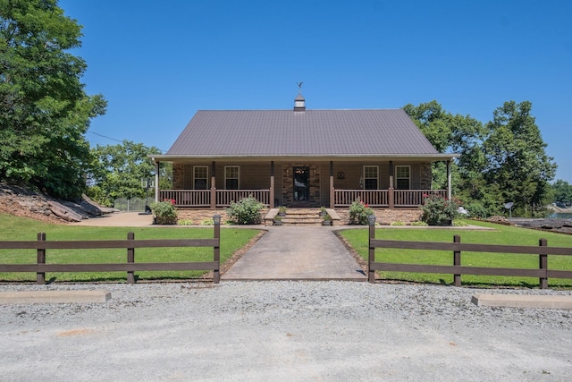 view of front of home with a front lawn and a porch