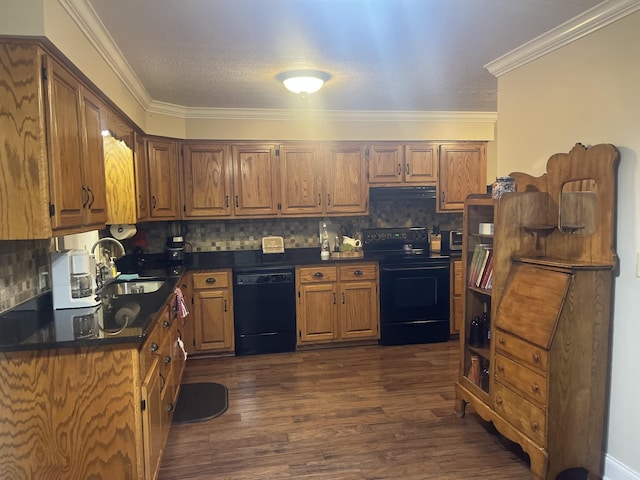 kitchen featuring sink, decorative backsplash, black appliances, crown molding, and dark wood-type flooring