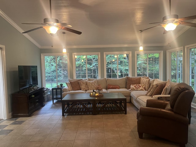 living room with ornamental molding, vaulted ceiling, light tile patterned flooring, and ceiling fan