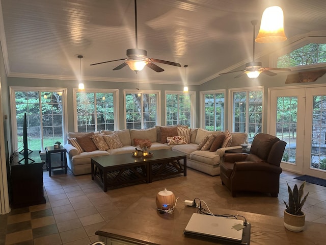 tiled living room featuring ornamental molding and vaulted ceiling