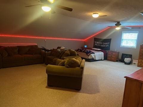 cinema featuring carpet floors, ceiling fan, and vaulted ceiling