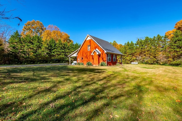 view of outbuilding with a yard