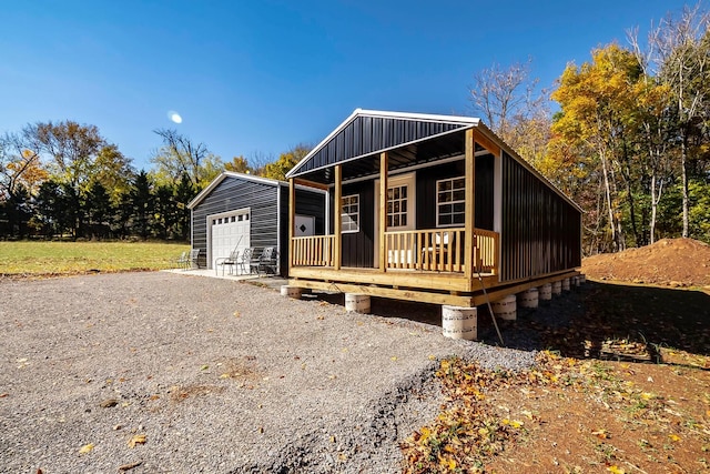 view of front facade featuring an outbuilding and a garage