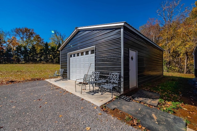 garage featuring a lawn