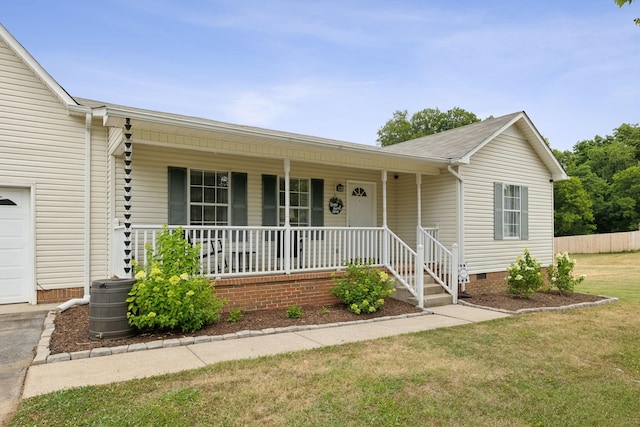 ranch-style home with covered porch and a front yard