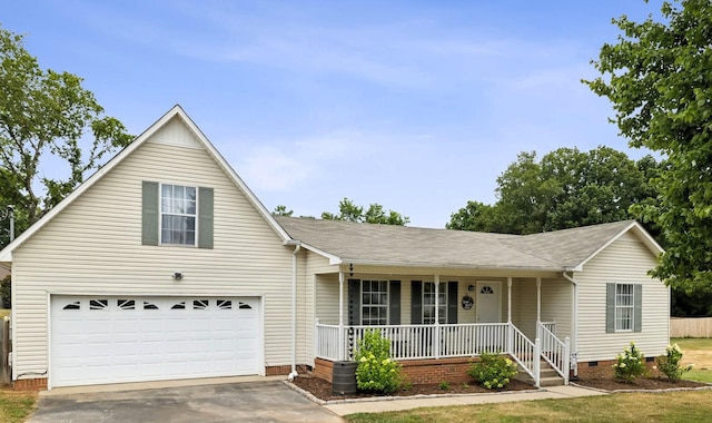 view of front facade with a garage and covered porch