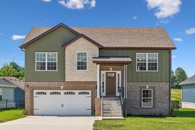 view of front facade with a garage and a front yard