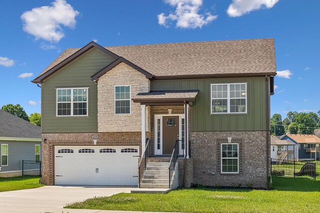 view of front of house with a front lawn and a garage