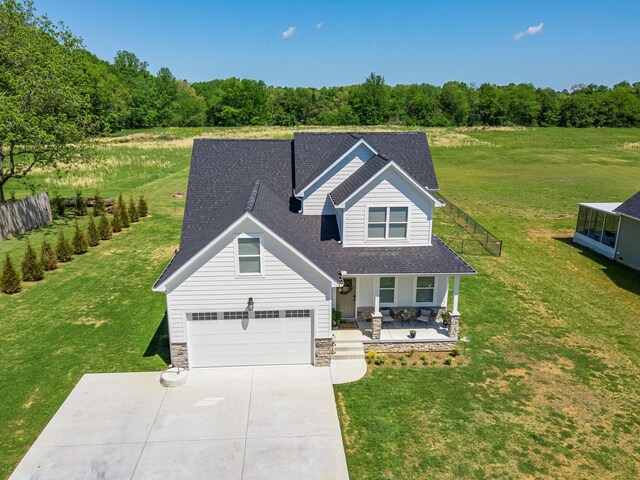 view of front of house with a garage and a front yard