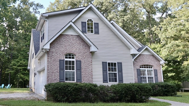 view of side of home featuring a garage