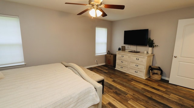 bedroom with ceiling fan and dark hardwood / wood-style flooring