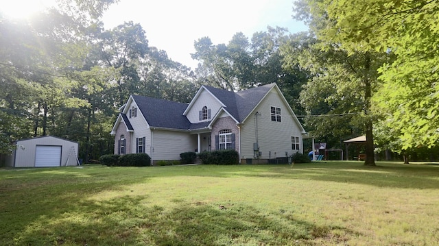 view of side of home featuring a playground, a yard, and an outdoor structure