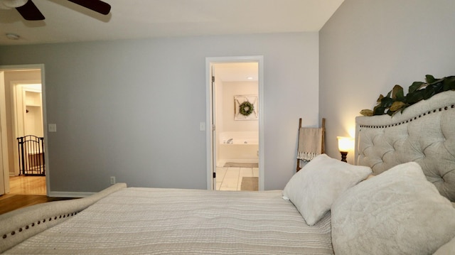 bedroom featuring ensuite bath and ceiling fan