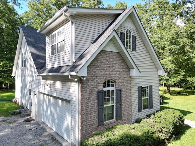 exterior space featuring a yard and a garage