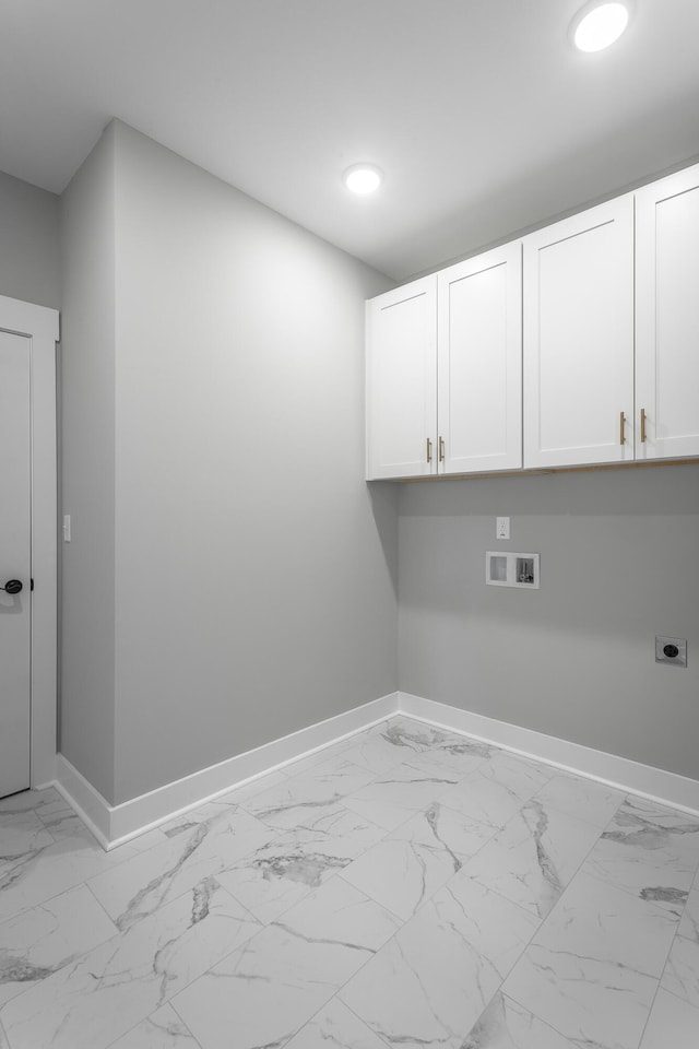 washroom featuring hookup for a washing machine, electric dryer hookup, and cabinets