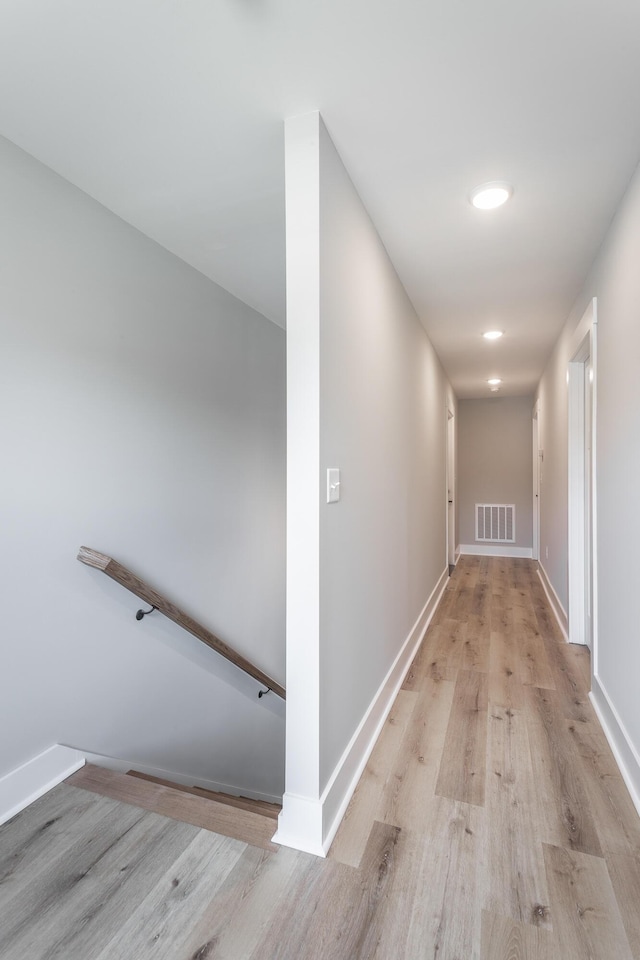 hallway with light wood-type flooring